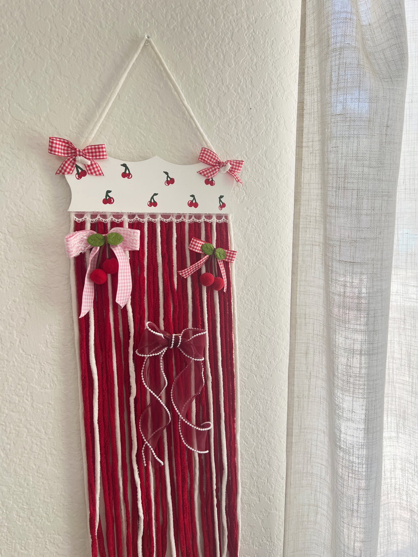 The cherry yarn bow holder