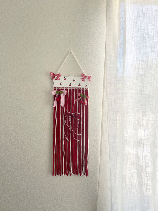 The cherry yarn bow holder